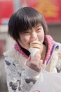 Young Chinese girl enjoys a MacDonald ice cream, Beijing, China